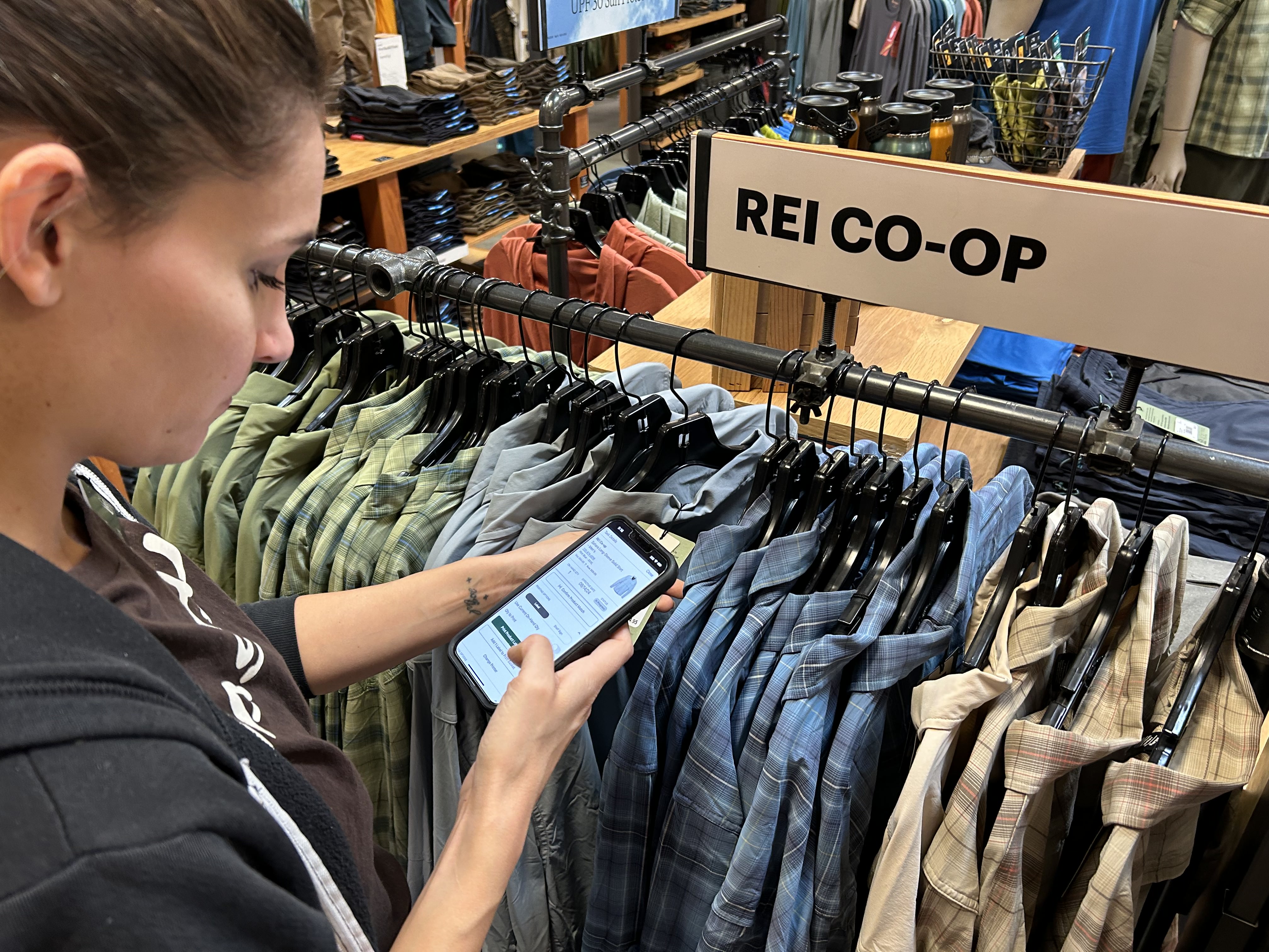 A store employee uses the price change tool in pilot